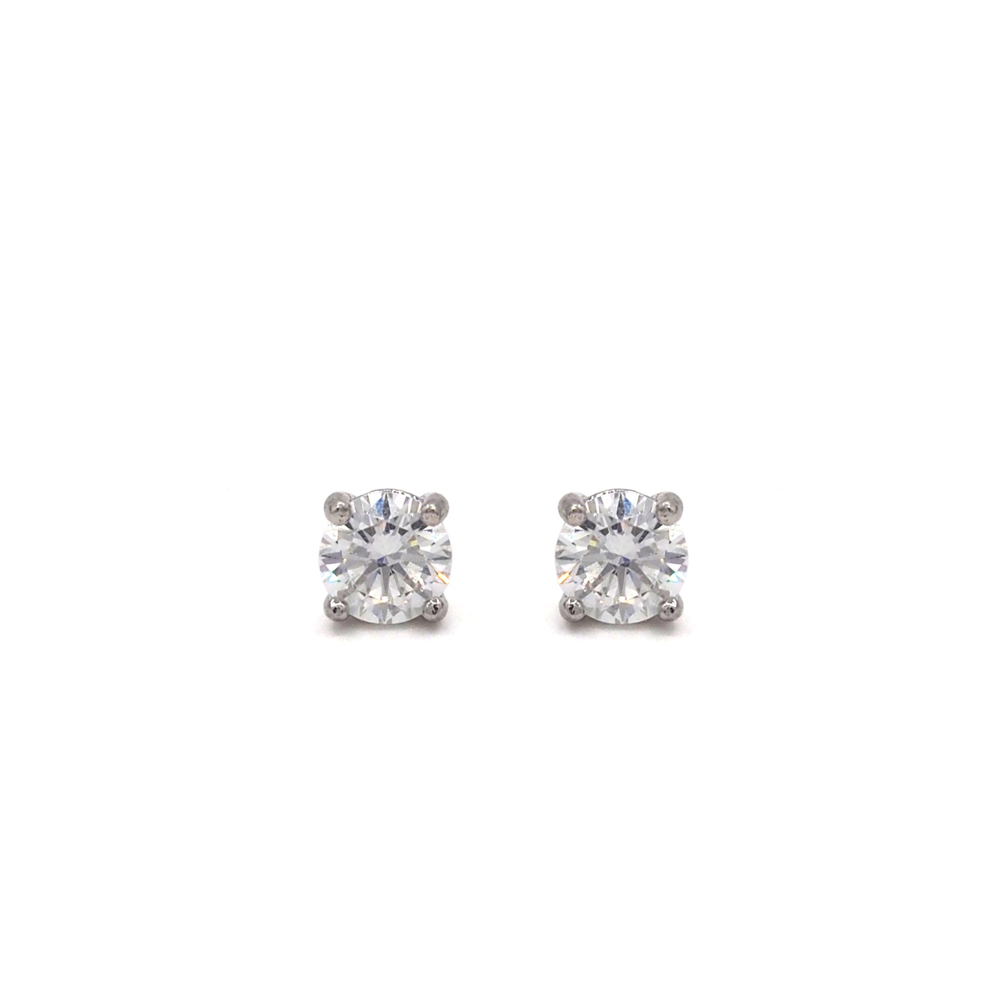 Lab grown diamond stud earrings 1ct on white background