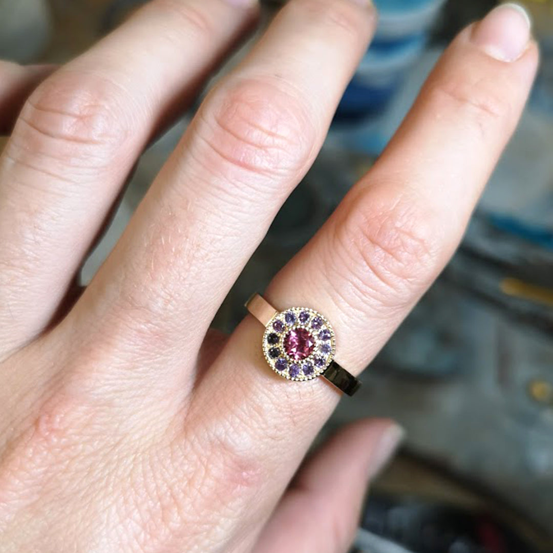 Mile End Sunset ring on a woman's pointer finger, a unique alternative bridal ring from Lico Jewelry