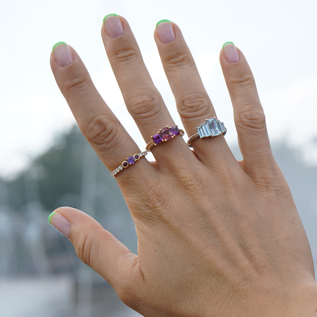 Model's Hand with Sultan Rin and other Rings against Sky Background - Lico Jewelry Montreal"