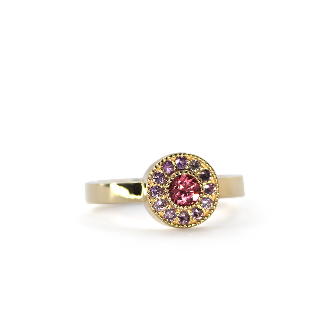 Mile End Sunset ring with salmon pink Spinel Mahenge and purple sapphire halo set in 14k yellow gold from Lico Jewelry