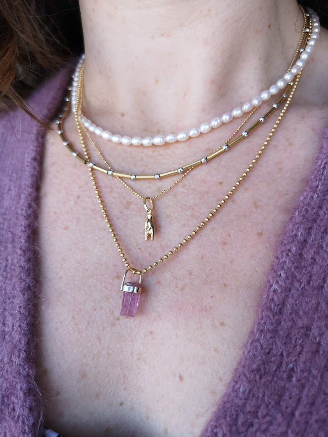Woman wearing four necklaces, two chains and two tourmaline crystal pendants, wholeness and healing, Lico Jewelry