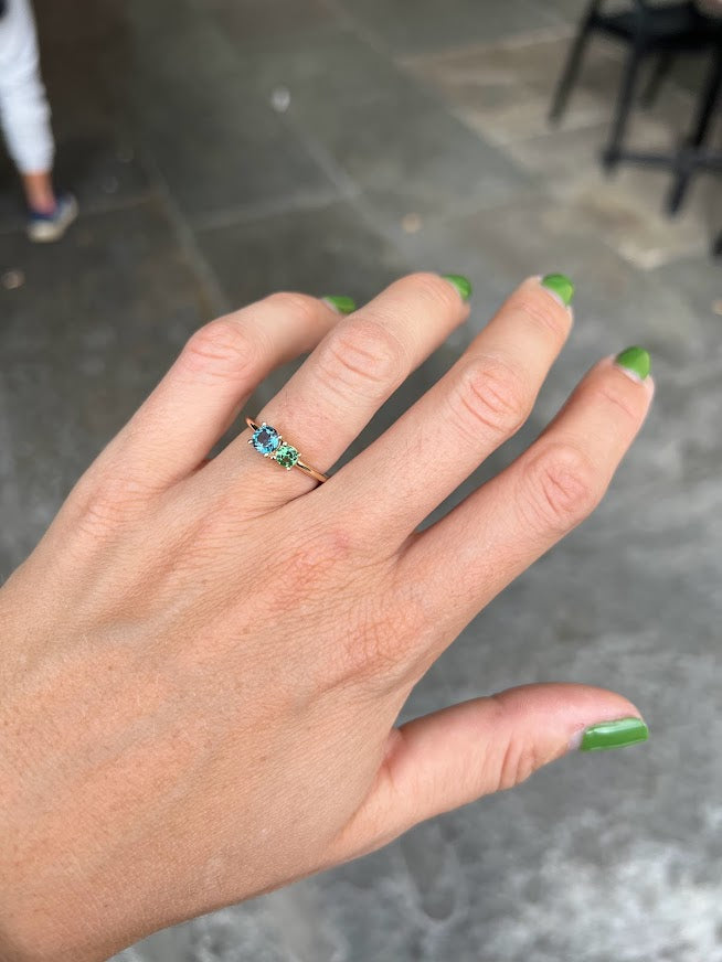 London lime ring on woman's finger with green nail polish
