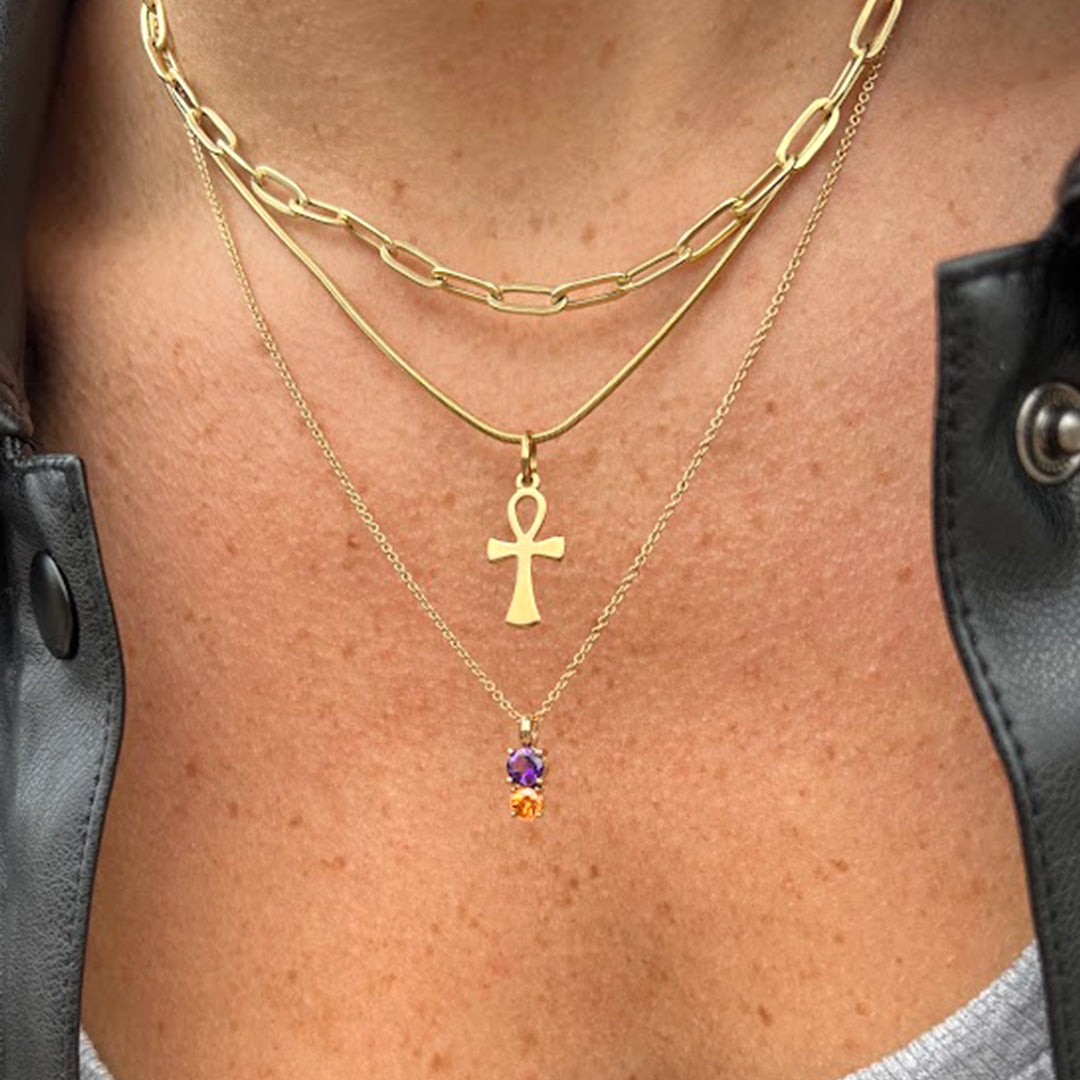 woman wearing the Iris Flower Pendant in solid 14k yellow gold with genuine amethyst and citrine from Lico Jewelry Montreal