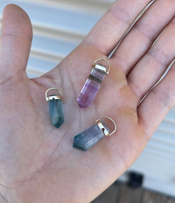 Lico Jewelry's Fluorite Crystal Pendants, handcrafted in Montreal with genuine fluorite crystals in shades of green, lilac and a hint of brown, each pendant is unique