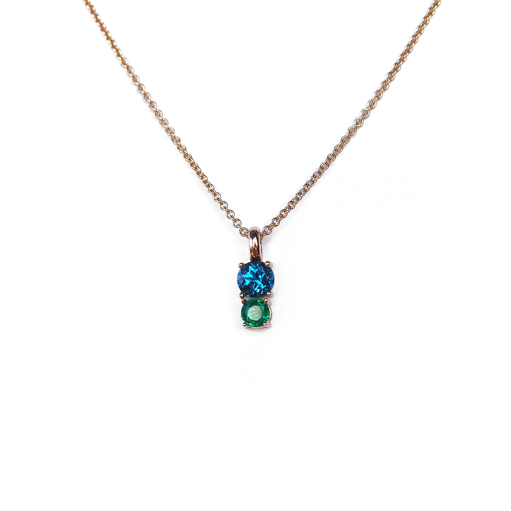 Beautiful 2 stone pendant in solid 14k yellow gold with genuine London blue topaz and emerald by Lico Jewelry.
