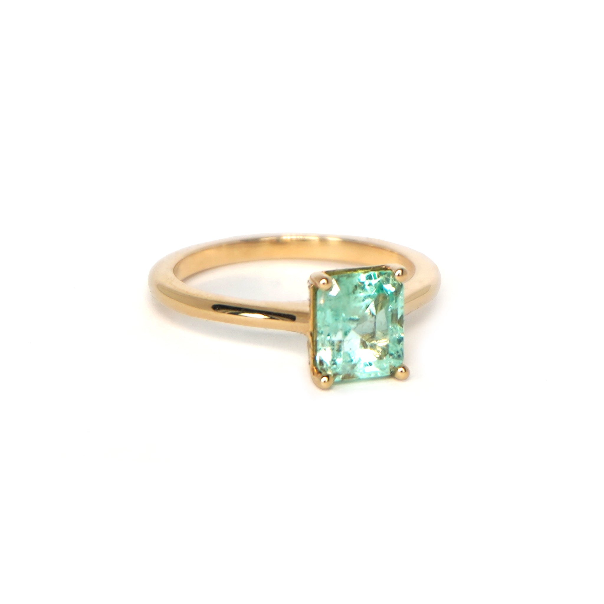 Side view of Lico Jewelry's Mint Solitaire ring with 1.57 ct Colombian emerald on white background