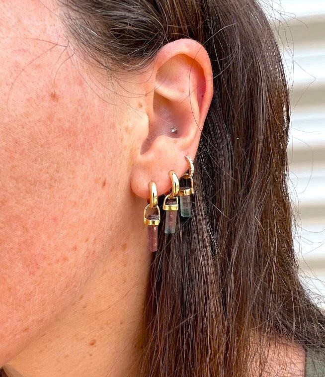 Woman wearing tourmaline crystal pendant as earrings, 14K gold, Lico Jewelry